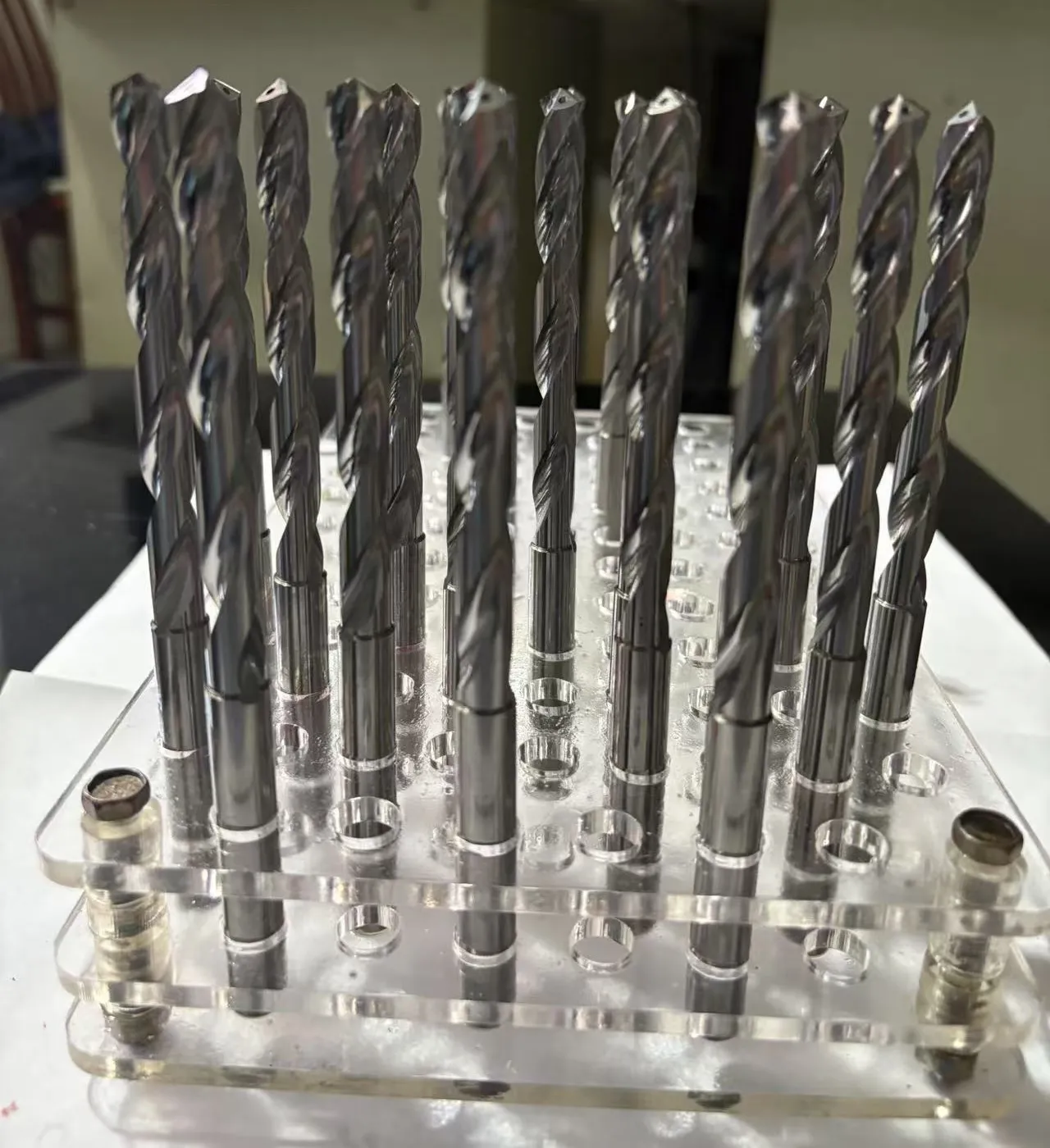 Custom coolant-through carbide drills before coating